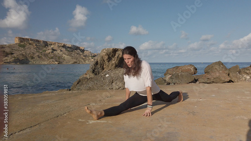 Young woman practising yoga, split position . High quality photo photo