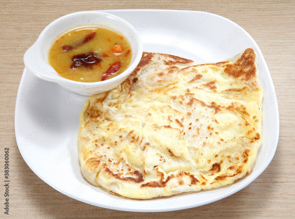 Roti canai or roti cane is a type of Indian-influenced flatbread found in Malaysia, Brunei, Indonesia and Singapore. It is often sold in Mamak stalls in Malaysia.