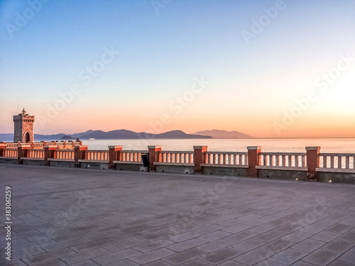 View of the sea and Isle of Elba at sunset from Piazza Bovio in Piombino, province of Livorno, Tuscany, Italy