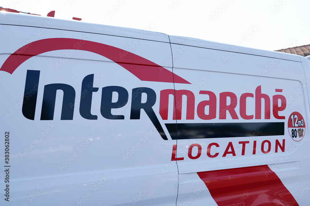 intermarche location logo and text sign on side truck panel detail rent