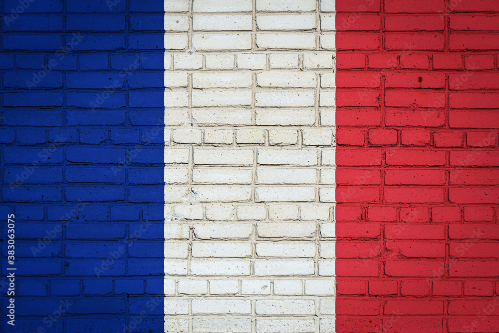 National flag of France depicting in paint colors on an old brick wall. Flag banner on brick wall background. National flag of France depicting in paint colors on an old brick wall. Flag banner on brick wall background.
