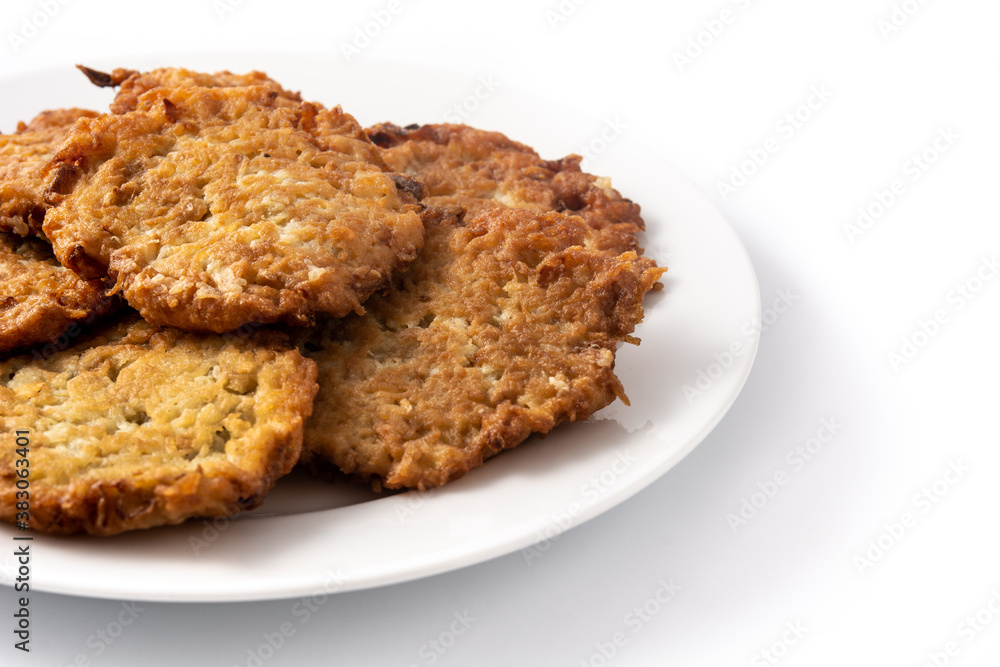 Traditional Jewish latkes or potato pancakes isolated on white background Traditional Jewish latkes or potato pancakes isolated on white background