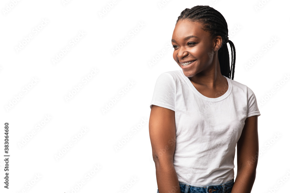 African Woman With Brackets Posing Looking Aside Over White Background