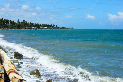 Small tropical town by the sea. Beautiful seascape.