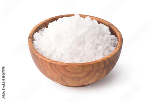 Natural sea salt in wooden bowl isolated on white background with clipping path.
