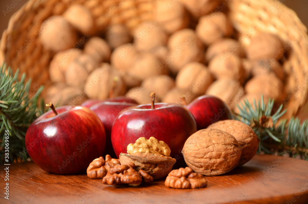 still life with nuts and red apples with bokeh effect still life with nuts and red apples with bokeh effect