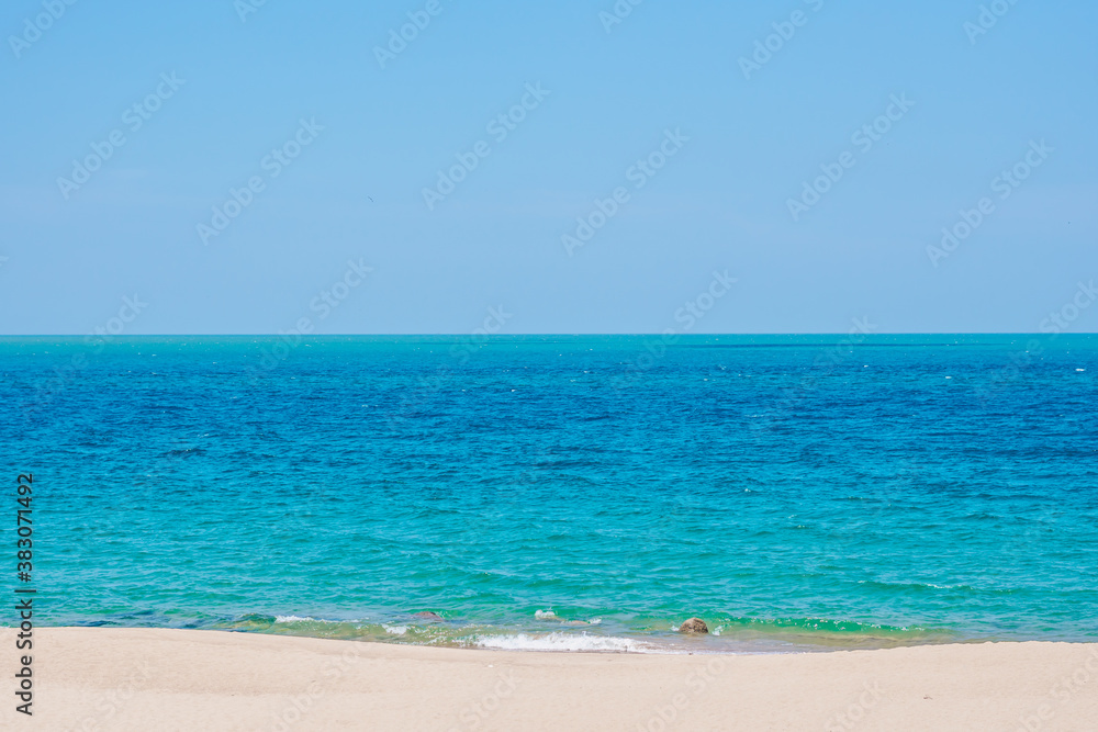 Deep blue turquoise lazur empty sea panorama skyline under clear sky summer sunshine clean sand, paradise calm design wallpaper background. Tropical holiday, end of quarantine Covid 19 isolation