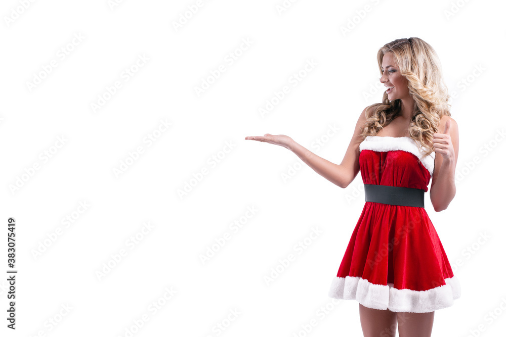 Portrait of a cheerful young blonde woman in red santa claus dress posing over white background. Portrait of a cheerful young blonde woman in red santa claus dress posing over white background.