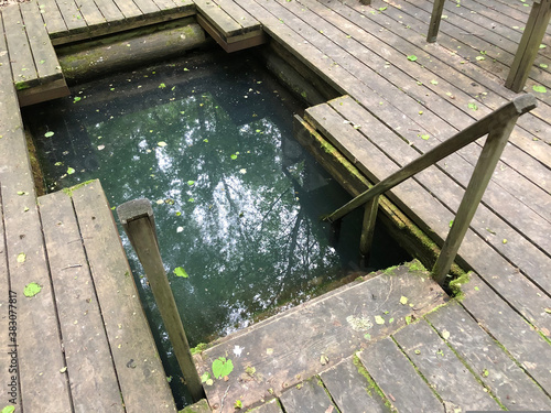 фотографія baptismal font with water