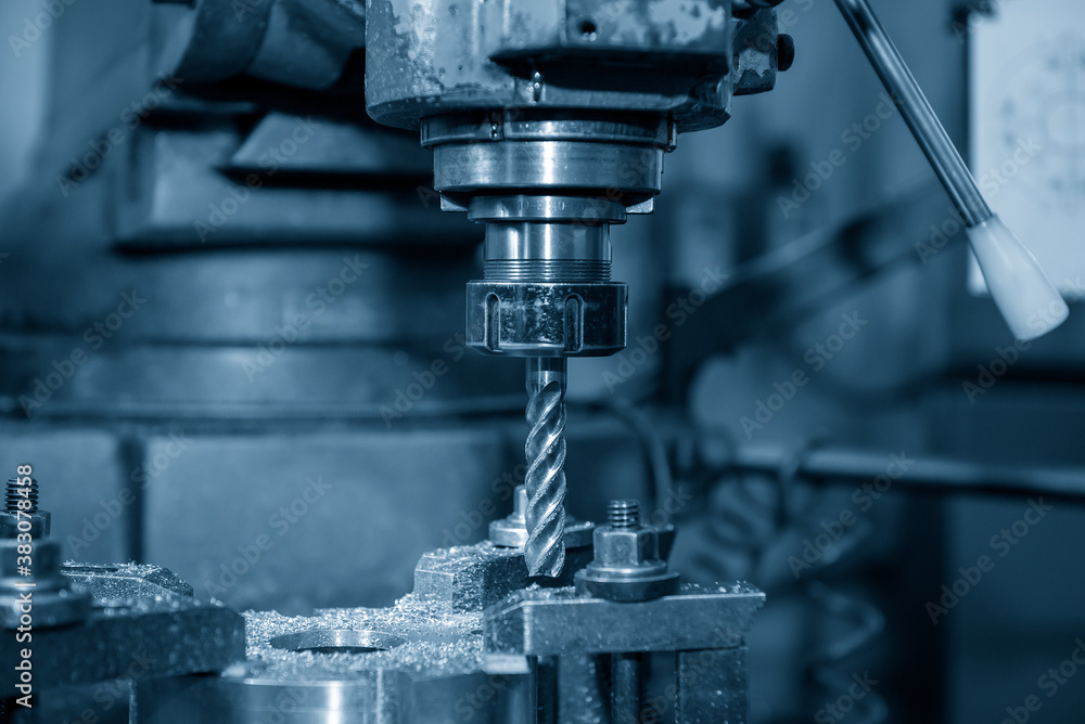 The NC milling machine milling at the metal plate by flat endmill tools. The shop floor operation by NC milling machine. The NC milling machine milling at the metal plate by flat endmill tools. The shop floor operation by NC milling machine.