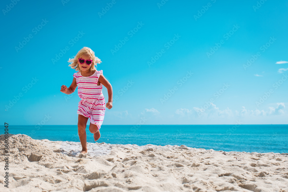 cute happy little girl running on beach Stock Photo Adobe Stock