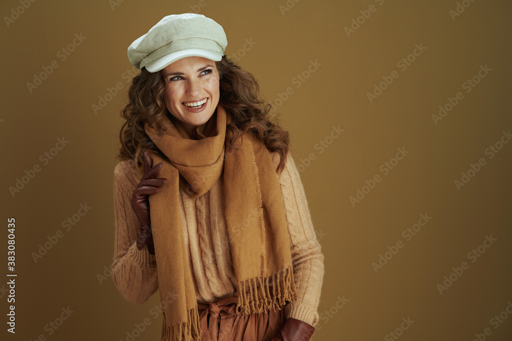 woman looking at copy space isolated on bronze background woman looking at copy space isolated on bronze background