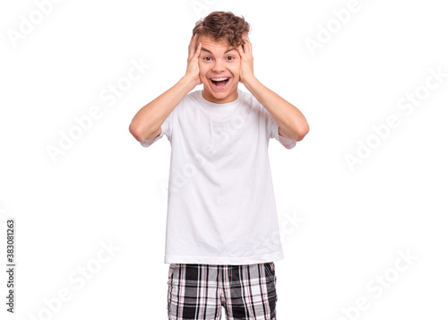 Handsome teen boy laughing looking very happy.