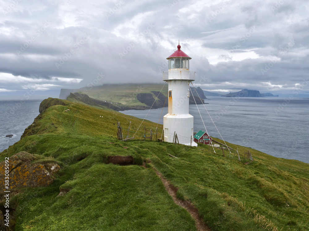 Panoramic view of Old lighthouse on the beautiful island Mykines, Faroe islands, Denmark