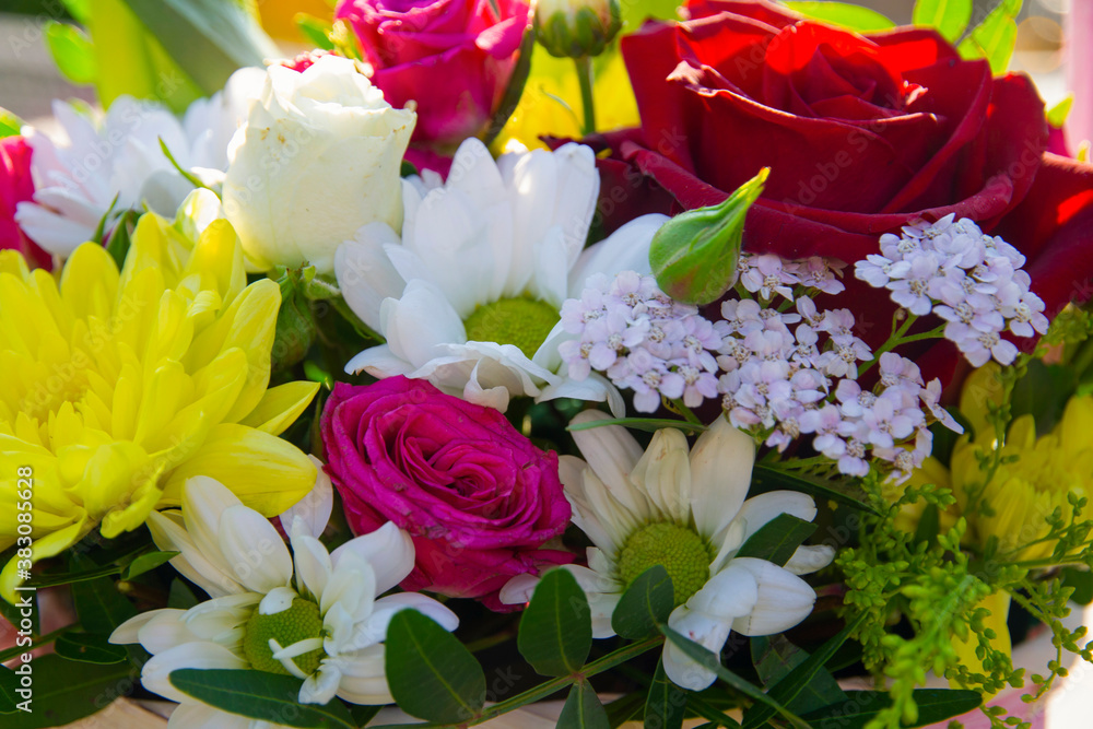 Fototapeta premium background of a bouquet of different flowers, different colors, the concept of birthday, wedding, date.