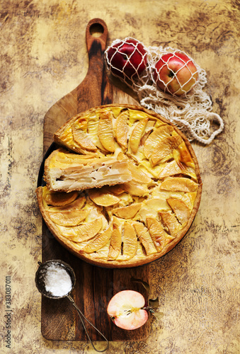 Apple pie on a wooden background