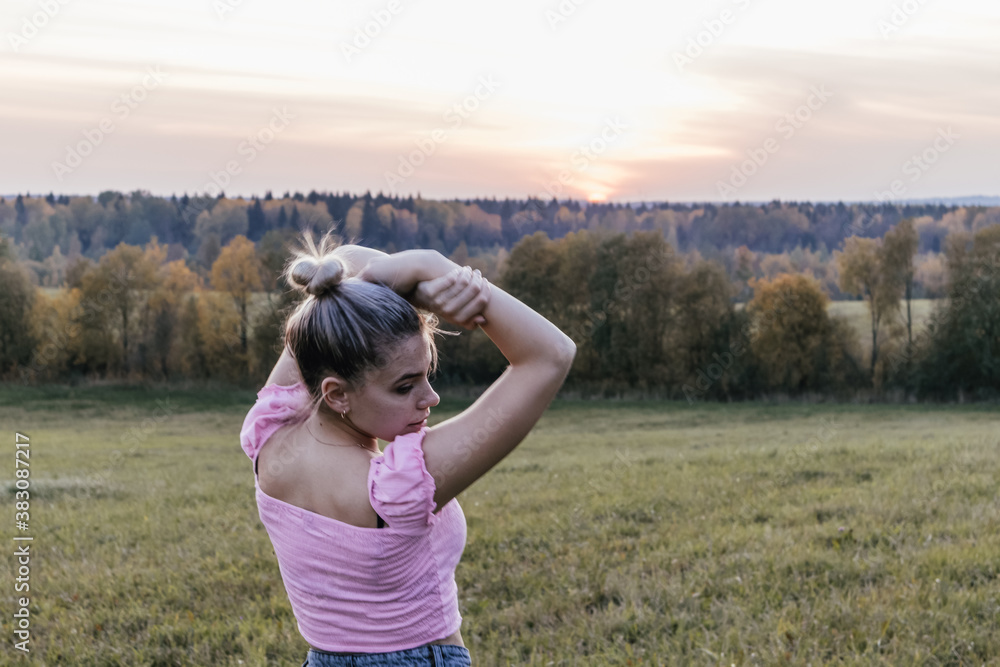 Girl in the field at sunset posing joy nature love happy Girl in the field at sunset posing joy nature love happy