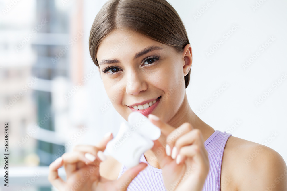 Portrait of beautiful woman cleaning teeth with dental floss Portrait of beautiful woman cleaning teeth with dental floss