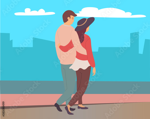 Couple walking in a city park. Young guy and girl hugging walking in evening alley, romantic walk. Lovers man and woman met on a date outdoor. Romantic promenade in the open air, active lifestyle