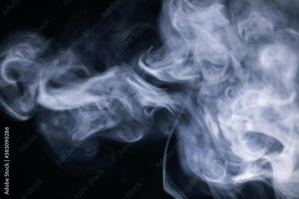 White cigarette smoke texture in a black background. White cigarette smoke texture in a black background.