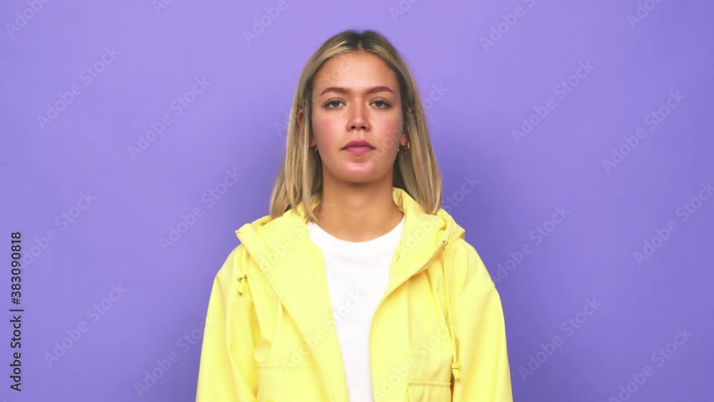 Young blonde caucasian woman focused on a task, keeping forefingers pointing head Young blonde caucasian woman focused on a task, keeping forefingers pointing head