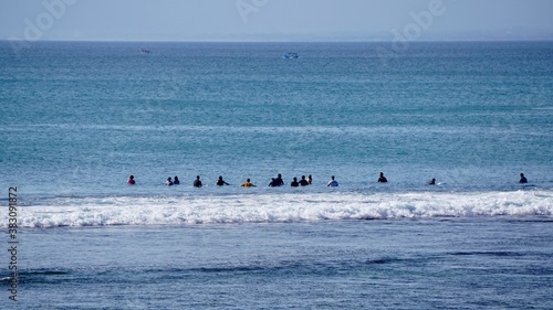 Surfers meeting in Bali waters