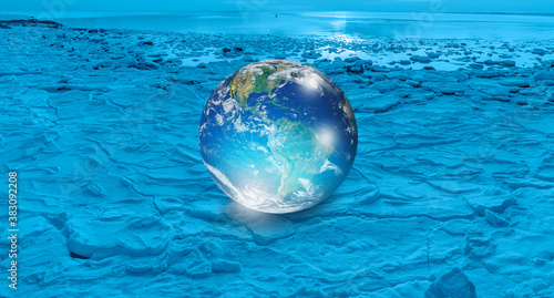 Glass Globe (planet earth) on ice "Elements of this image furnished by NASA