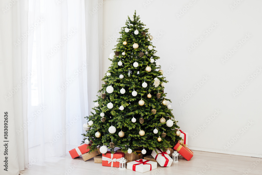 Winter Christmas tree pine with gifts new year decor garland interior of the holiday home December