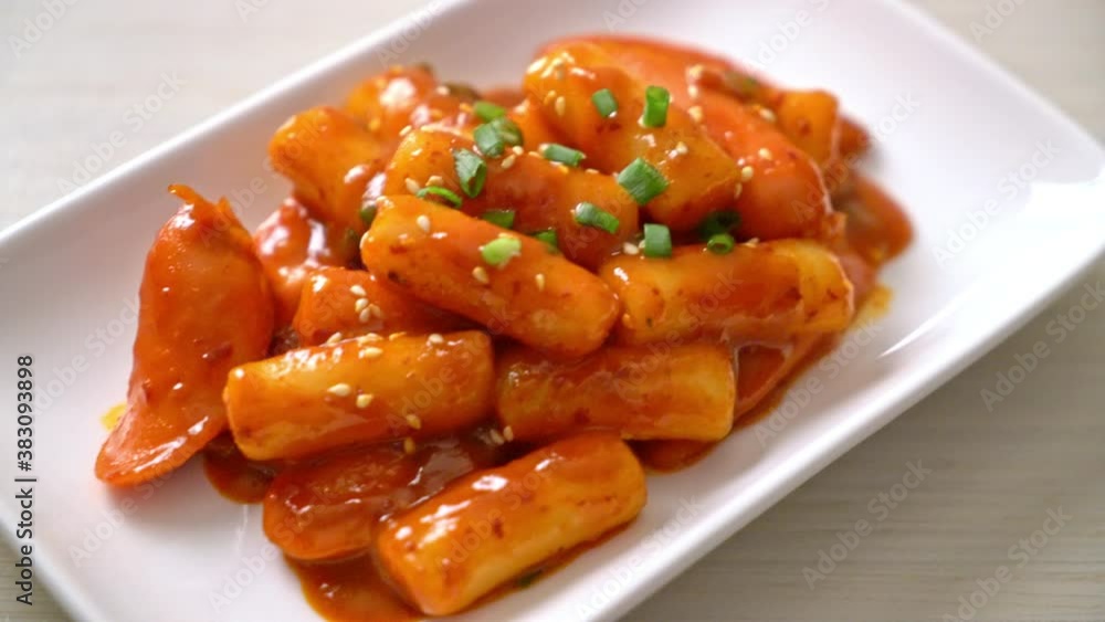 Korean rice cake stick with sausage in spicy sauce - Tteokbokki Korean rice cake stick with sausage in spicy sauce - Tteokbokki