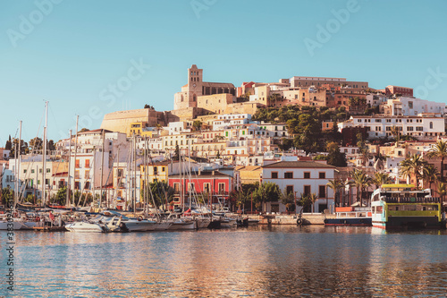 Selective focus on building  beautiful Ibiza old town with blue Mediterranean sea and city view in the morning