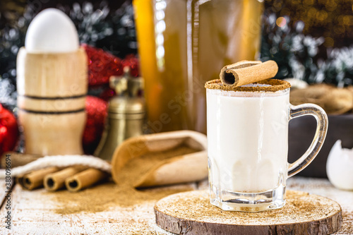 Eggnog, a warm winter drink that contains the following ingredients: egg yolk sugar, milk, sour cream, nutmeg and, optionally, an alcoholic drink such as bourbon (a type of whiskey), rum or cognac. photo