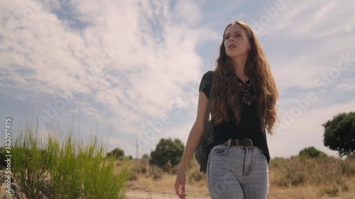 Travelling of a good-looking model walking and enjoying the environment