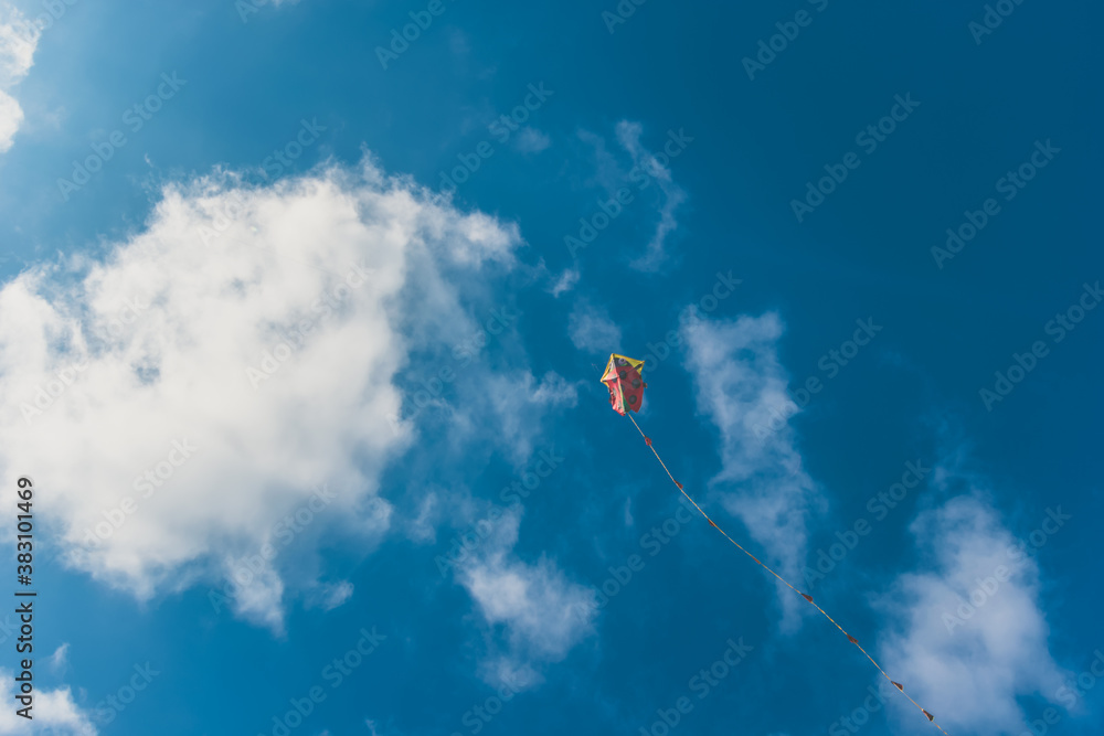 colorful kite flying up in the sky