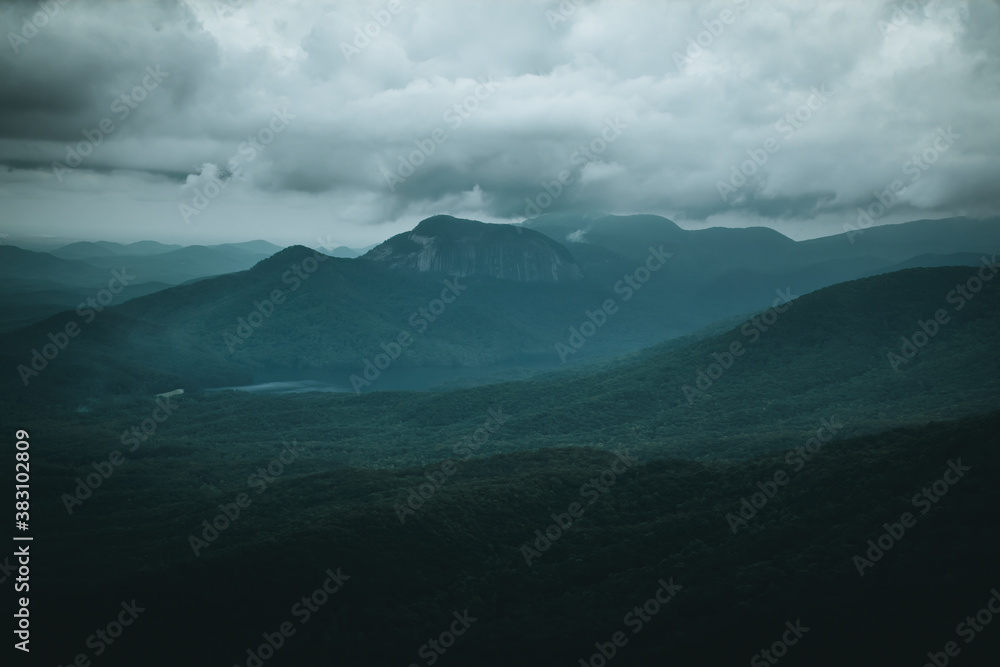 Low, moody clouds over scenic Table Rock and surrounding mountains in South Carolina. Low, moody clouds over scenic Table Rock and surrounding mountains in South Carolina.