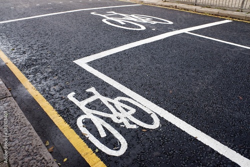 White painted cycle lane markings on tarmac road surface