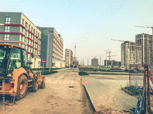 industrial site. construction of a large residential complex. life of people in multi-storey colored houses. uniform style of home decoration. concrete block houses © Aliaksandra