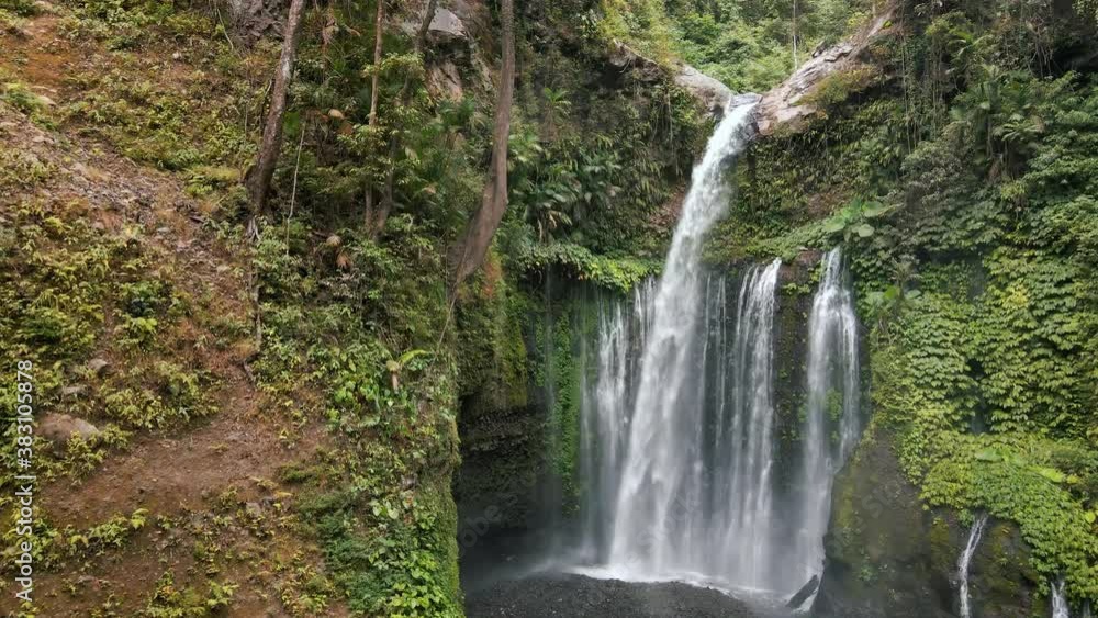 Cinematic aerial view of Sedang Gile Waterfall in Lombok,Indonesia.Slow forward. Cinematic aerial view of Sedang Gile Waterfall in Lombok,Indonesia.Slow forward.