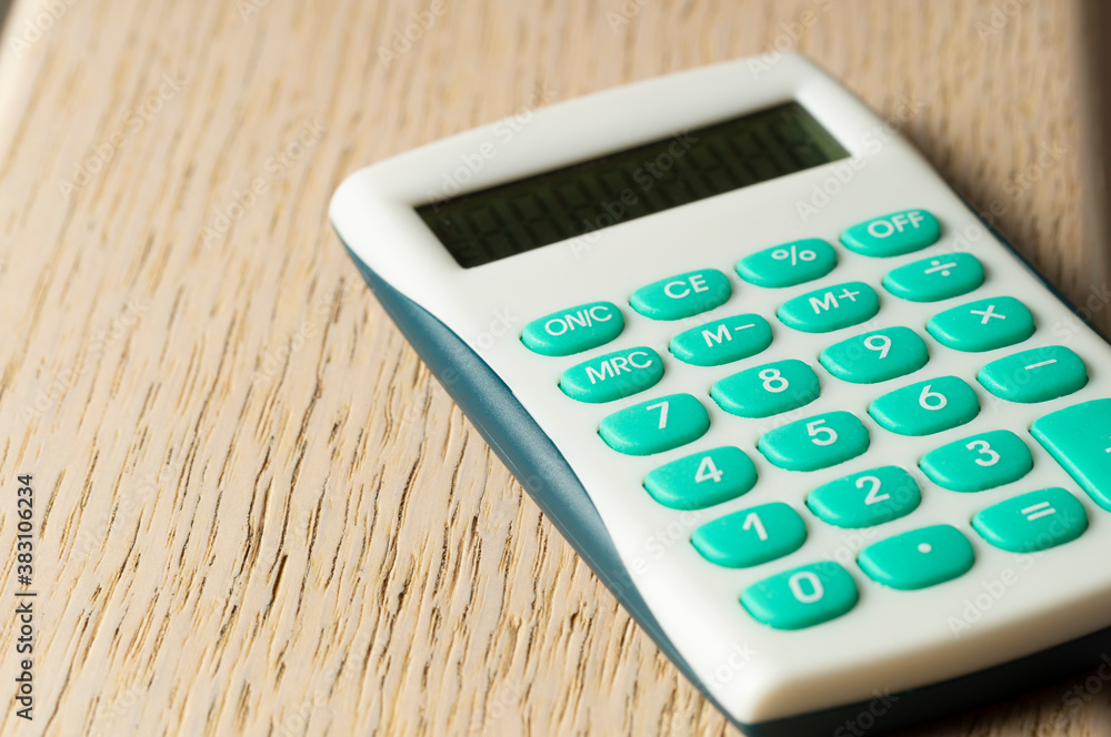 calculator on wooden background close up calculator on wooden background close up