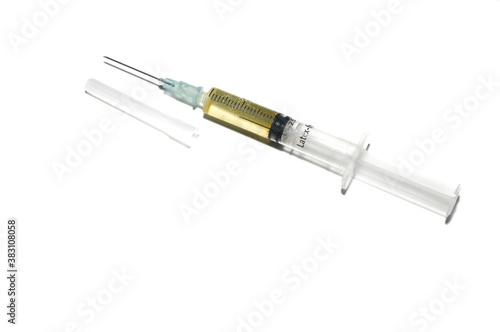 A syringe about to be injected as a vaccine to fight the coronavirus. (COVID-19).