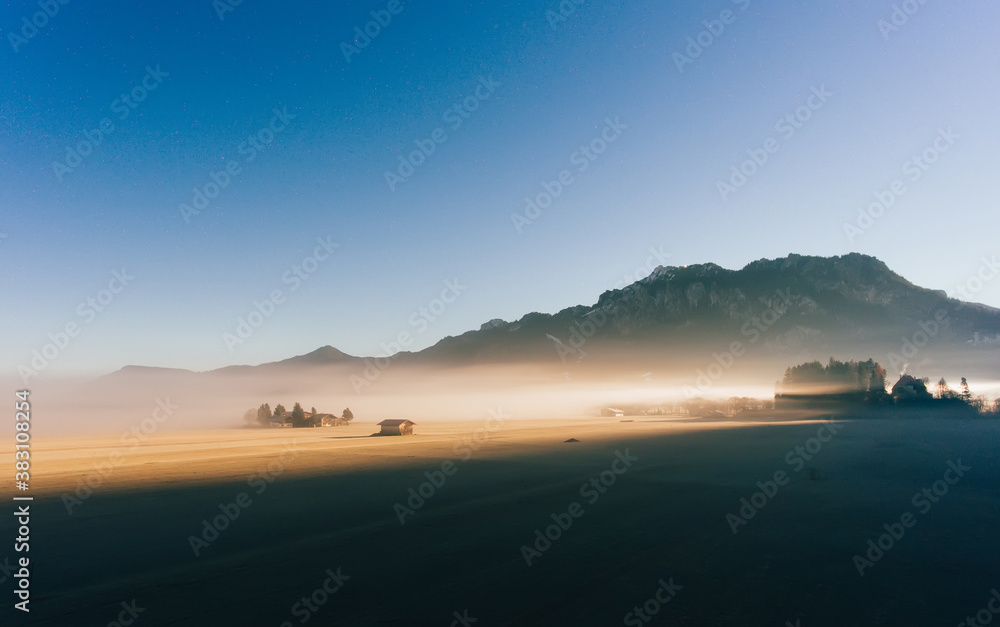 Sunset over mountainous terrain in evening Sunset over mountainous terrain in evening
