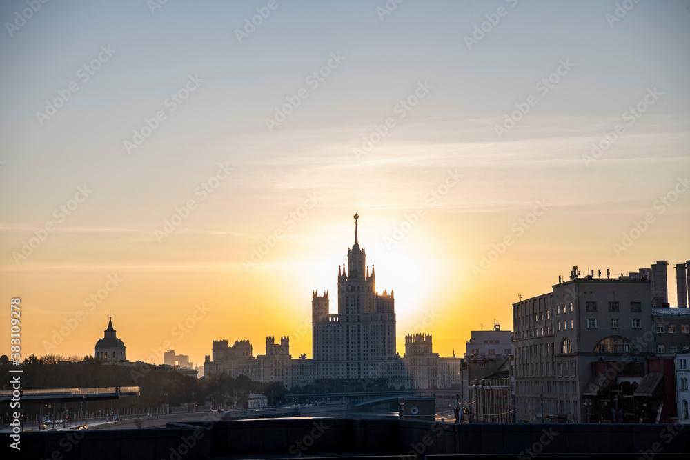cityscape with ancient buildings and skyscrapers at sunrise