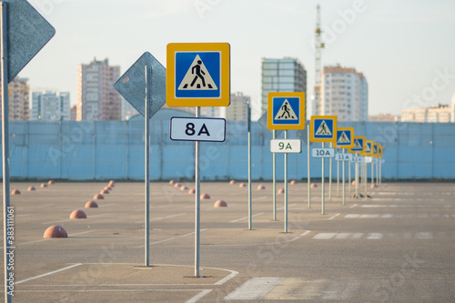 Many signs of a pedestrian crossing