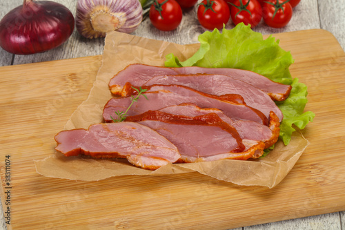 Sliced smoked duck breast served salad