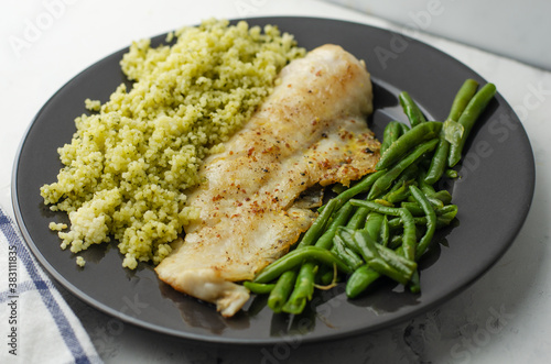 Hake fish, green beans and couscous