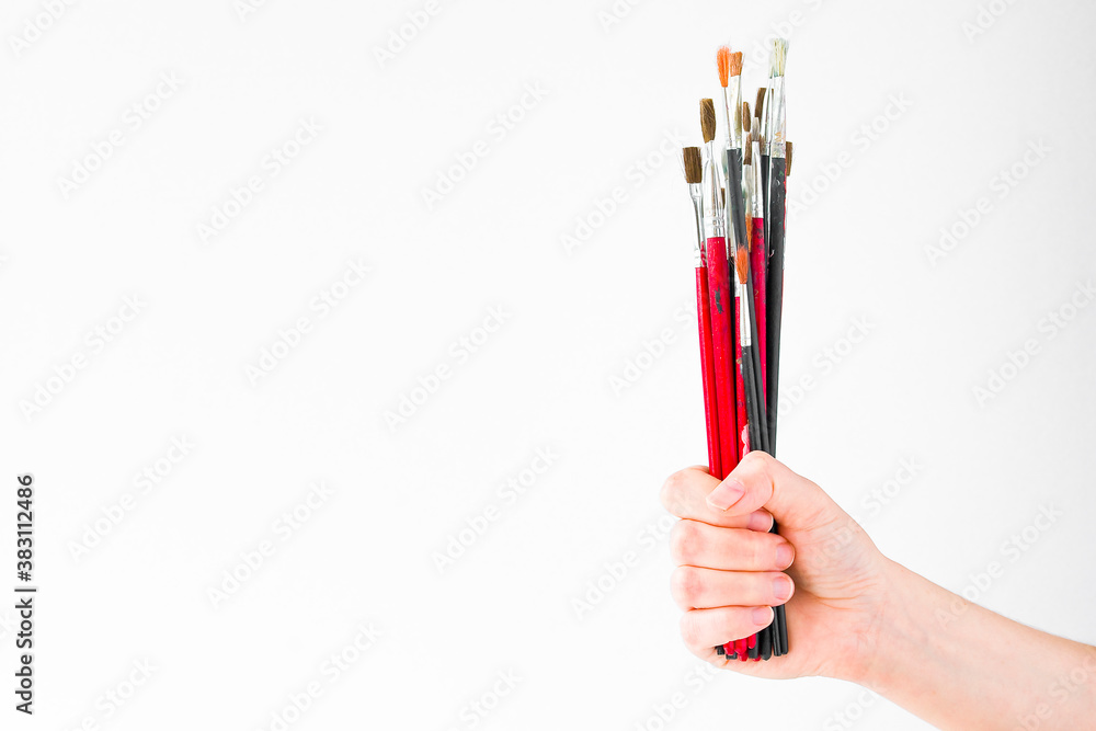 hand with paintbrush isolated hand with paintbrush isolated