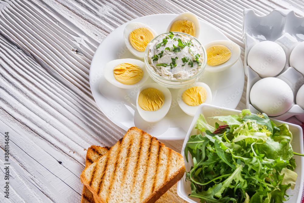 boiled chicken eggs on a white wooden rustic background boiled chicken eggs on a white wooden rustic background