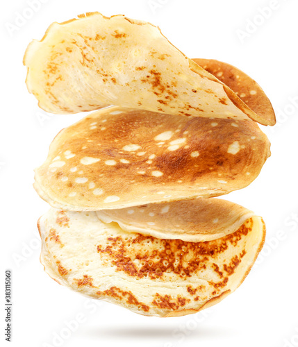 Thin pancakes are flying on a white background. Isolated