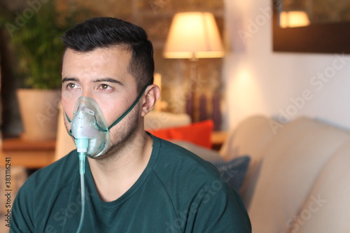 Young Hispanic man using ventilator 
