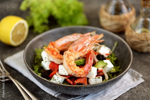 Greek salad with grilled shrimps. Healthly food.