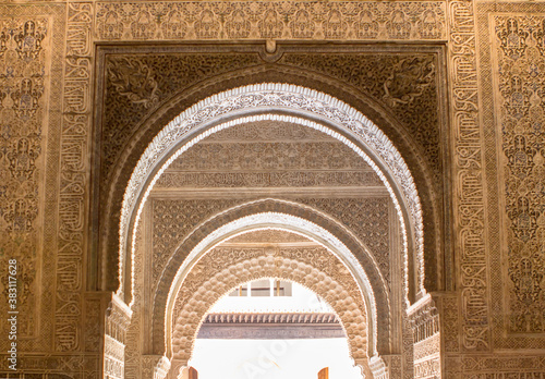 Ornate arches in a  Lions patio of Alhambra, Granada, Spain photo